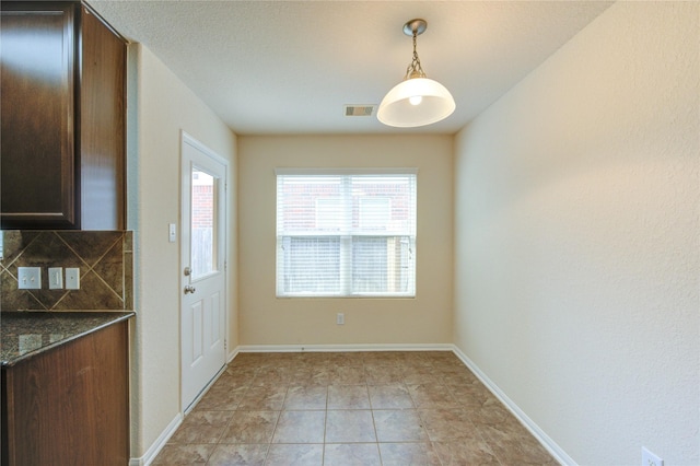 14839 Fir Knoll Way, Cypress, TX 77429 - unfurnished dining area featuring light tile patterned floors and baseboards
