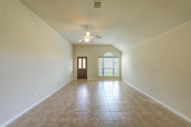 14839 Fir Knoll Way, Cypress, TX 77429 - tiled empty room featuring ceiling fan, a textured wall, lofted ceiling, and a textured ceiling