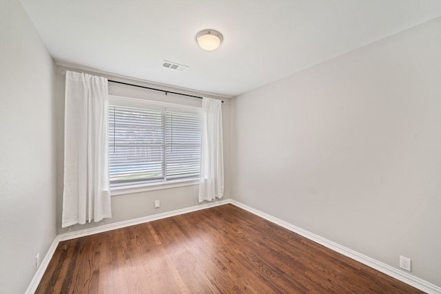2111 Bron Holly Dr, Houston, TX 77018 - spare room with baseboards and dark wood-style flooring