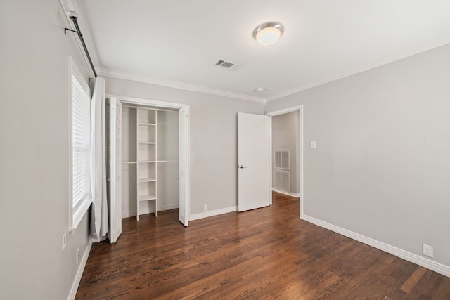 2111 Bron Holly Dr, Houston, TX 77018 - unfurnished bedroom with dark wood-style flooring, ornamental molding, and a closet