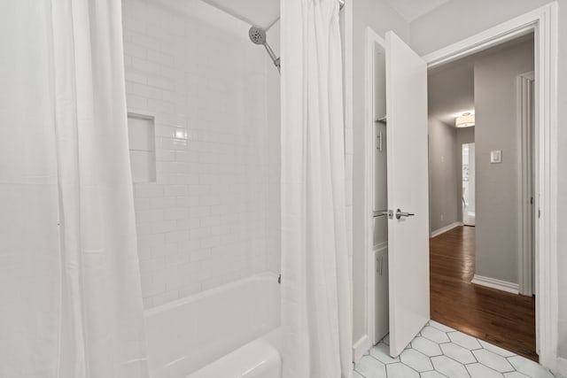 2111 Bron Holly Dr, Houston, TX 77018 - bathroom with shower / tub combo with curtain and tile patterned flooring