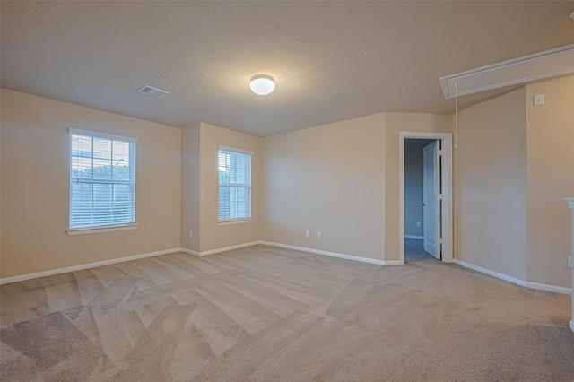 8134 Menorca Cove Dr, Cypress, TX 77433 - unfurnished room featuring attic access and light carpet