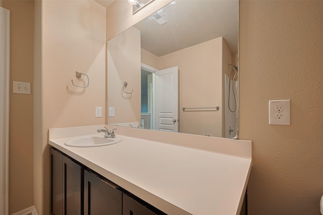 8134 Menorca Cove Dr, Cypress, TX 77433 - bathroom featuring vanity and a shower