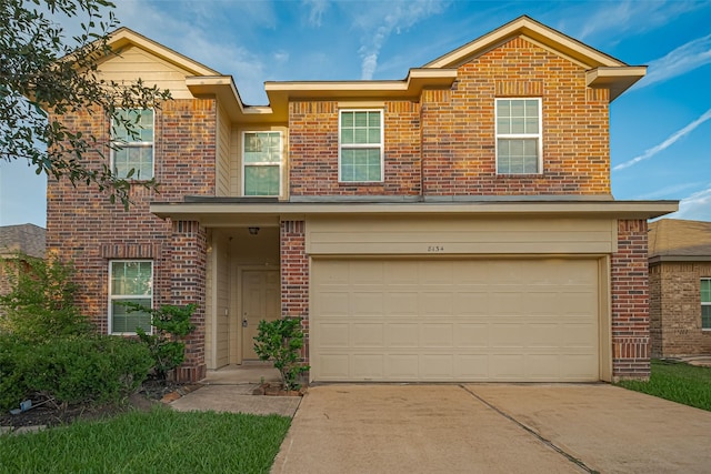 8134 Menorca Cove Dr, Cypress, TX 77433 - traditional home with brick siding, concrete driveway, and a garage