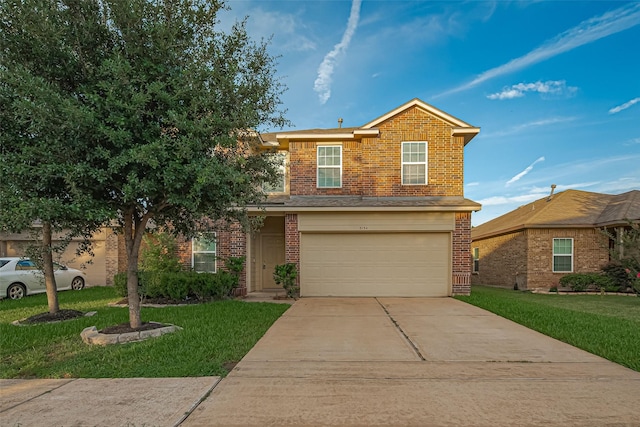8134 Menorca Cove Dr, Cypress, TX 77433 - traditional-style house featuring brick siding, concrete driveway, an attached garage, and a front yard