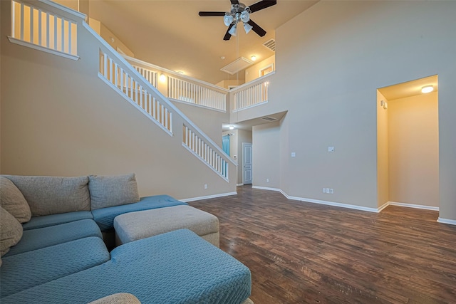 8134 Menorca Cove Dr, Cypress, TX 77433 - living area with ceiling fan, wood finished floors, stairway, and a towering ceiling