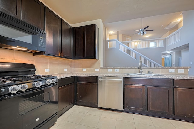 8134 Menorca Cove Dr, Cypress, TX 77433 - kitchen with black appliances, ceiling fan, light countertops, dark brown cabinetry, and decorative backsplash