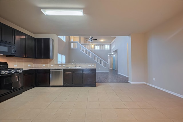 8134 Menorca Cove Dr, Cypress, TX 77433 - kitchen featuring black appliances, light countertops, tasteful backsplash, a peninsula, and ceiling fan