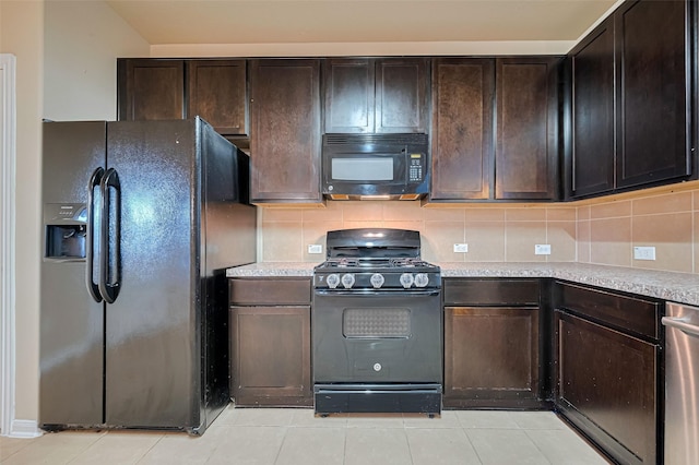 8134 Menorca Cove Dr, Cypress, TX 77433 - kitchen with black appliances, tasteful backsplash, dark brown cabinetry, and light tile patterned floors