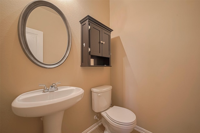 8134 Menorca Cove Dr, Cypress, TX 77433 - bathroom featuring toilet and baseboards