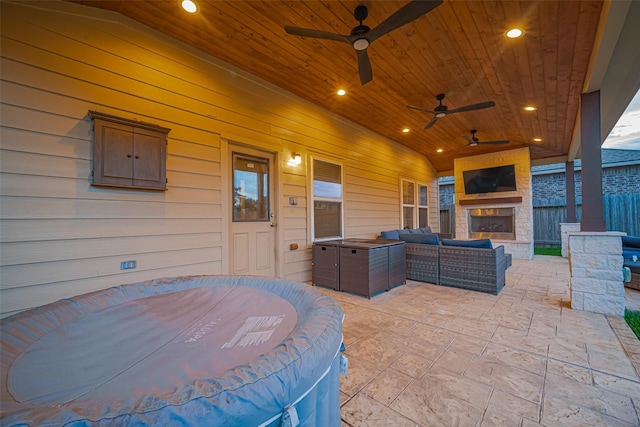 8134 Menorca Cove Dr, Cypress, TX 77433 - view of patio featuring an outdoor living space with a fireplace and ceiling fan