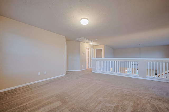 8134 Menorca Cove Dr, Cypress, TX 77433 - unfurnished room with attic access, light colored carpet, and a textured ceiling