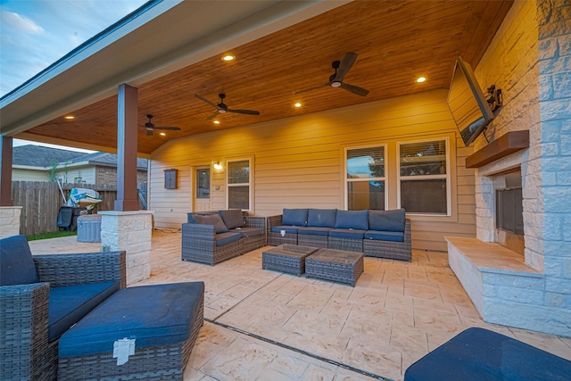 8134 Menorca Cove Dr, Cypress, TX 77433 - view of patio / terrace with an outdoor living space with a fireplace and ceiling fan