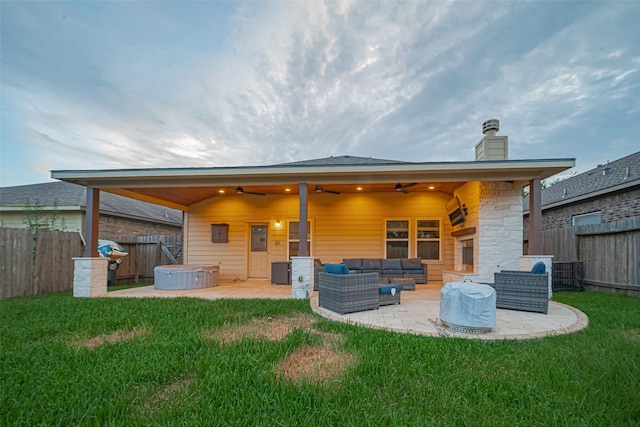 8134 Menorca Cove Dr, Cypress, TX 77433 - back of property featuring outdoor lounge area, a ceiling fan, a hot tub, a chimney, and a patio area