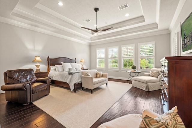 32723 Westminster Dr, Fulshear, TX 77441 - bedroom with a raised ceiling, multiple windows, dark wood-style flooring, ornamental molding, and recessed lighting