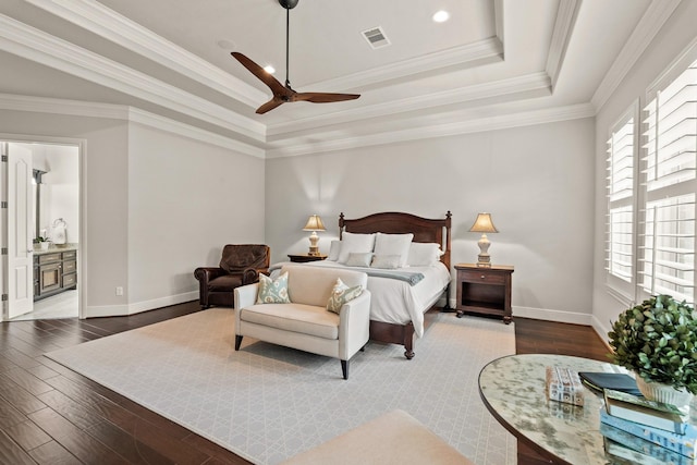 32723 Westminster Dr, Fulshear, TX 77441 - bedroom featuring a tray ceiling, wood finished floors, crown molding, ceiling fan, and ensuite bathroom
