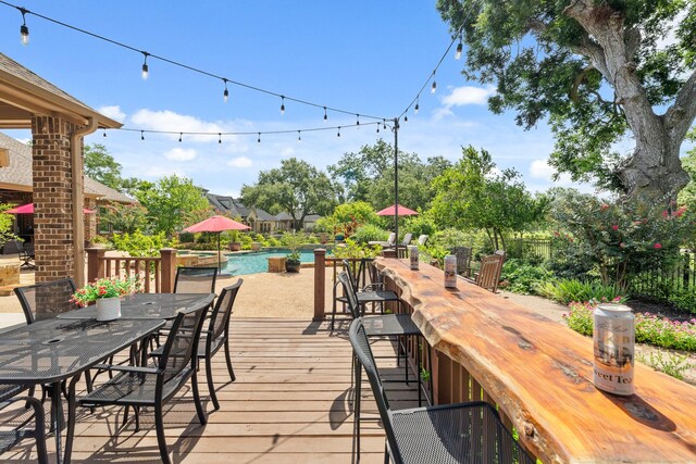 32723 Westminster Dr, Fulshear, TX 77441 - wooden terrace with outdoor dining space and an outdoor pool