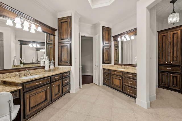 32723 Westminster Dr, Fulshear, TX 77441 - full bathroom with two vanities, ornamental molding, and tile patterned flooring