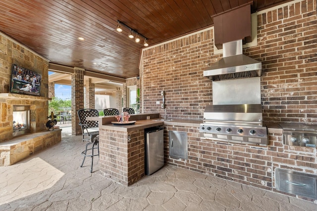 32723 Westminster Dr, Fulshear, TX 77441 - view of patio featuring a multi sided fireplace and an outdoor kitchen