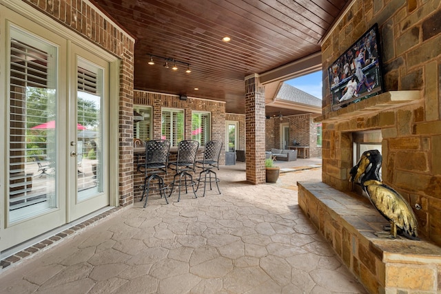 32723 Westminster Dr, Fulshear, TX 77441 - view of patio / terrace with an outdoor stone fireplace