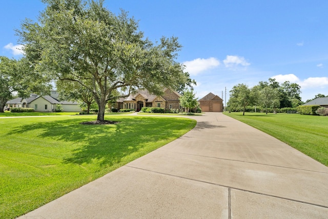 32723 Westminster Dr, Fulshear, TX 77441 - view of front of property featuring a front lawn, curved driveway, and a residential view