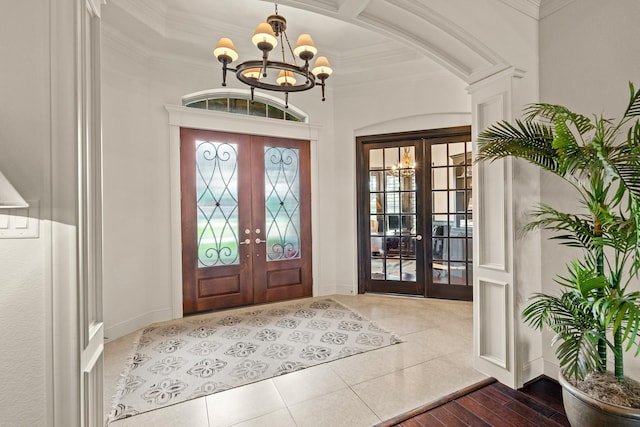 32723 Westminster Dr, Fulshear, TX 77441 - entryway featuring french doors, a chandelier, crown molding, and tile patterned flooring