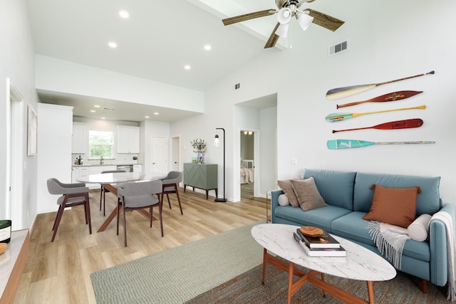 1927 Duncan Dr, Oyster Creek, TX 77541 - living room featuring light wood-style floors, high vaulted ceiling, ceiling fan, and recessed lighting