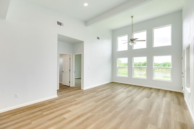 1927 Duncan Dr, Oyster Creek, TX 77541 - spare room featuring ceiling fan, light wood-style flooring, recessed lighting, a towering ceiling, and beamed ceiling