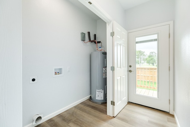 1927 Duncan Dr, Oyster Creek, TX 77541 - laundry area featuring water heater, electric dryer hookup, washer hookup, and light wood-type flooring