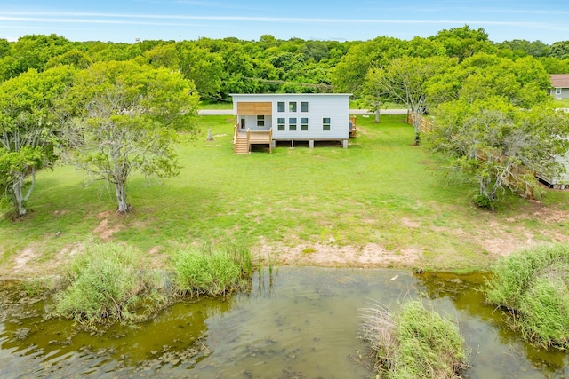 1927 Duncan Dr, Oyster Creek, TX 77541 - view of subject property with a nearby body of water and a forest