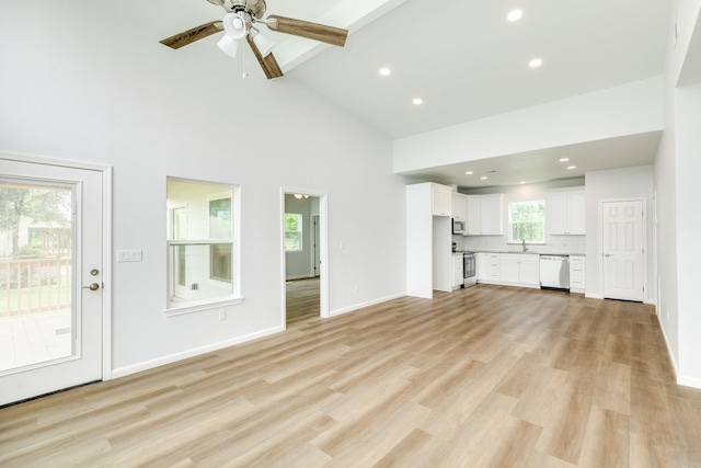 1927 Duncan Dr, Oyster Creek, TX 77541 - unfurnished living room featuring high vaulted ceiling, ceiling fan, recessed lighting, light wood finished floors, and beam ceiling