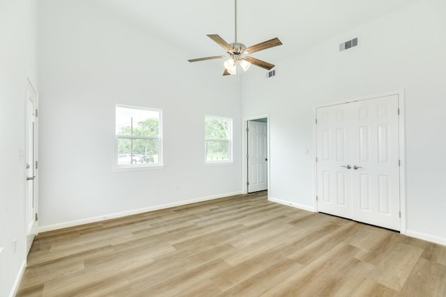 1927 Duncan Dr, Oyster Creek, TX 77541 - unfurnished bedroom featuring high vaulted ceiling, light wood finished floors, and a ceiling fan