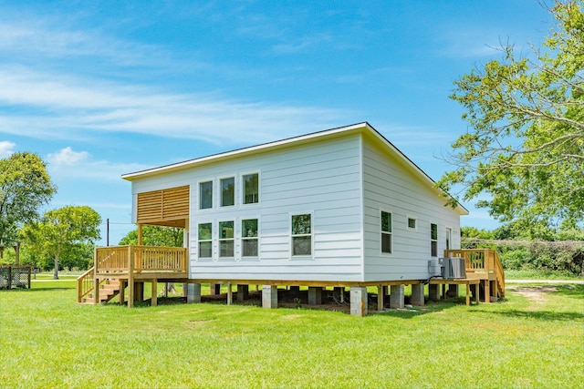1927 Duncan Dr, Oyster Creek, TX 77541 - back of house with a wooden deck, stairway, and a lawn