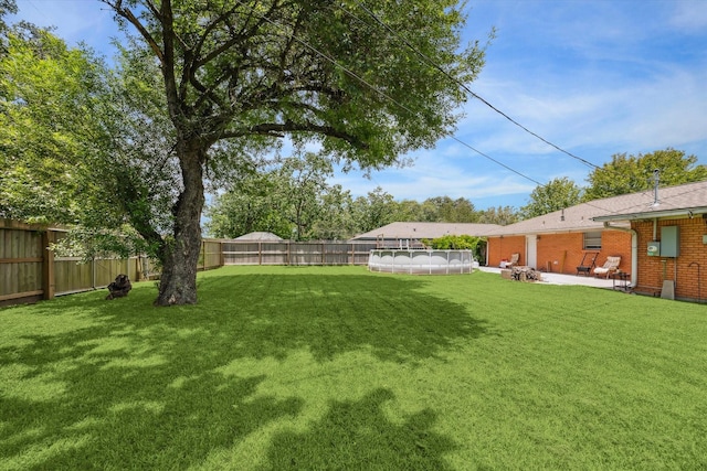 1905 17th Ave N, Texas City, TX 77590 - fenced backyard with a swimming pool and a patio area