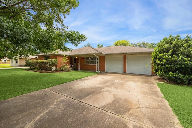 1905 17th Ave N, Texas City, TX 77590 - single story home with an attached garage, driveway, brick siding, and a front yard