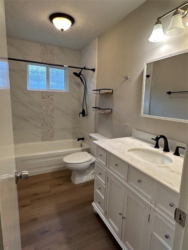 9219 Benwick Dr, Spring, TX 77379 - bathroom featuring shower / bath combination, wood finished floors, and vanity