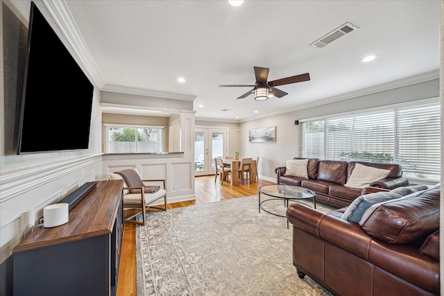 6518 Lindyann Ln, Houston, TX 77008 - living area featuring crown molding, a ceiling fan, light wood-style flooring, recessed lighting, and french doors