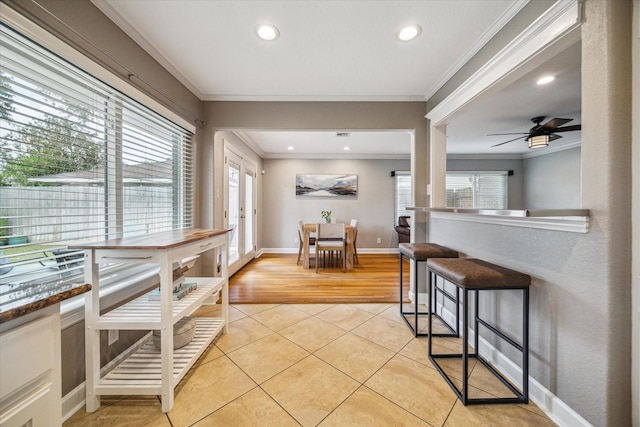 6518 Lindyann Ln, Houston, TX 77008 - dining area with light tile patterned flooring, plenty of natural light, ornamental molding, recessed lighting, and ceiling fan