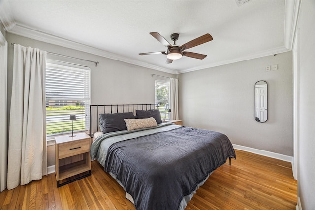 6518 Lindyann Ln, Houston, TX 77008 - bedroom featuring wood-type flooring, ornamental molding, and a ceiling fan