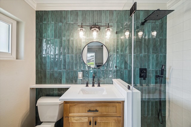 6518 Lindyann Ln, Houston, TX 77008 - bathroom featuring a shower stall, vanity, tile walls, and ornamental molding