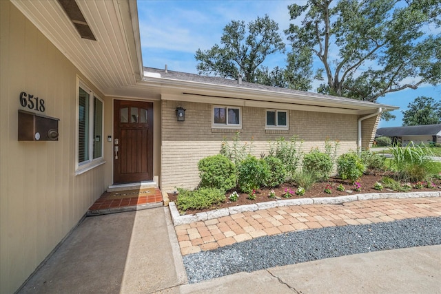 6518 Lindyann Ln, Houston, TX 77008 - property entrance with brick siding and roof with shingles