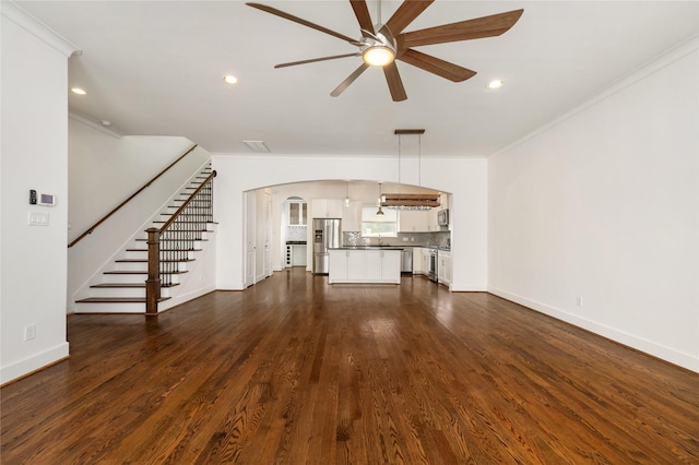 829 Wakefield Dr Unit A, Houston, TX 77018 - unfurnished living room with ornamental molding, ceiling fan, arched walkways, recessed lighting, and dark wood-style floors