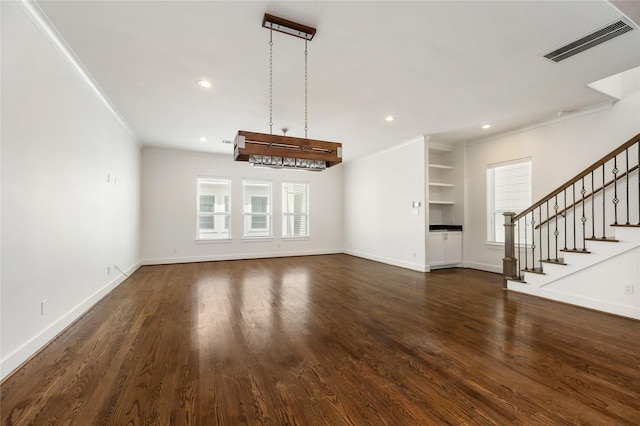 829 Wakefield Dr Unit A, Houston, TX 77018 - unfurnished living room featuring ornamental molding, recessed lighting, dark wood finished floors, stairs, and built in features
