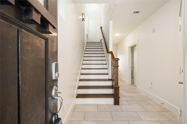 829 Wakefield Dr Unit A, Houston, TX 77018 - staircase featuring tile patterned floors and baseboards