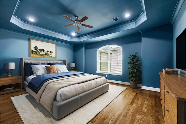 829 Wakefield Dr Unit A, Houston, TX 77018 - bedroom with a raised ceiling, crown molding, wood finished floors, and a ceiling fan