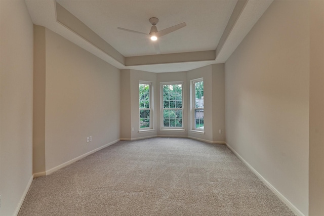 62 N Turtle Rock Ct, The Woodlands, TX 77381 - unfurnished room with carpet, a ceiling fan, and a tray ceiling
