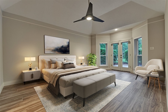 62 N Turtle Rock Ct, The Woodlands, TX 77381 - bedroom featuring access to outside, wood finished floors, french doors, vaulted ceiling, and recessed lighting