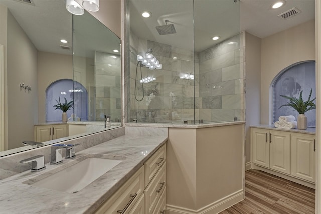 62 N Turtle Rock Ct, The Woodlands, TX 77381 - full bath with vanity, wood finished floors, walk in shower, and recessed lighting