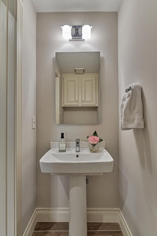 62 N Turtle Rock Ct, The Woodlands, TX 77381 - bathroom featuring wood finished floors