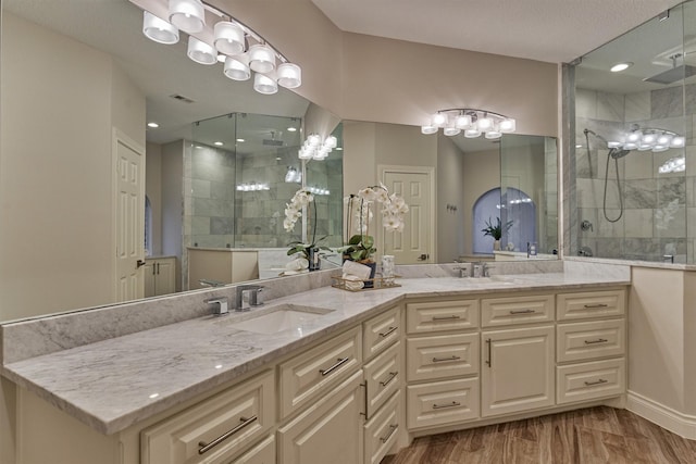 62 N Turtle Rock Ct, The Woodlands, TX 77381 - full bathroom with double vanity, a shower stall, and recessed lighting